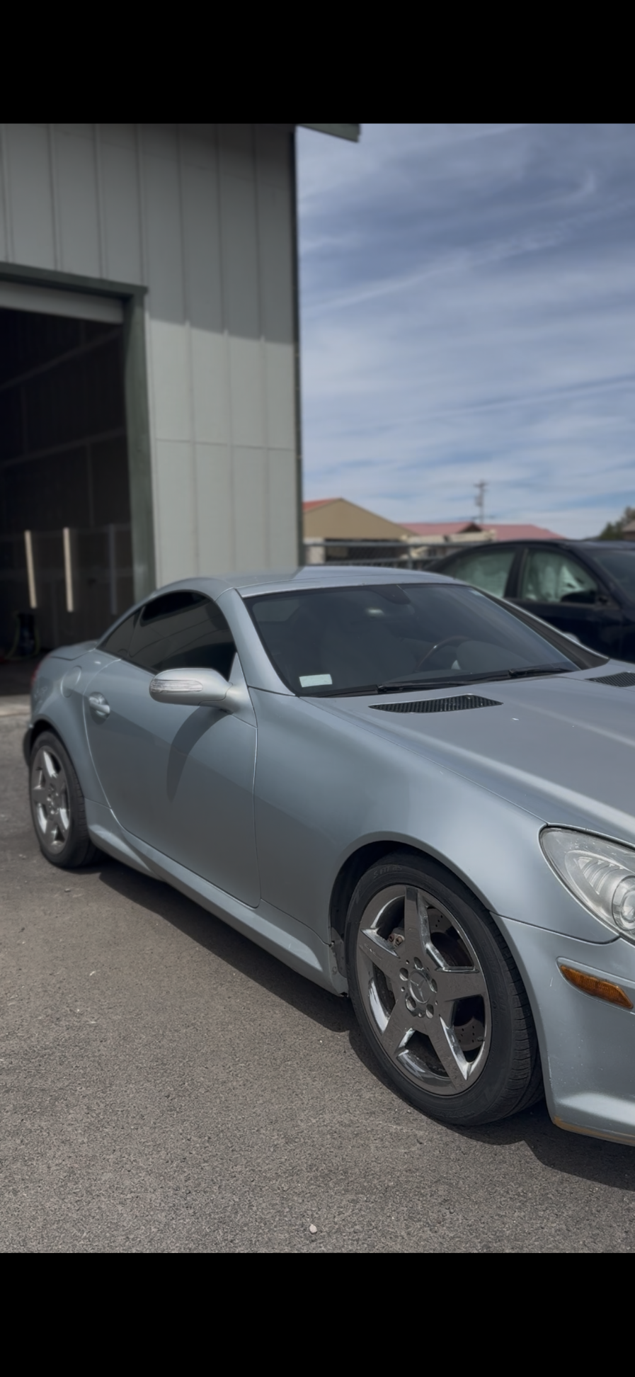 Silver Mercedes SLK convertible with dark ceramic window tint